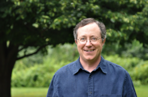 Man in front of a tree