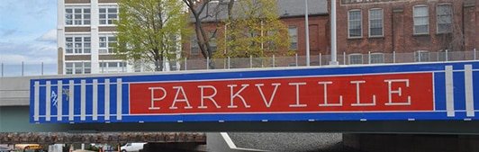 Parkville sign over train track in Hartford