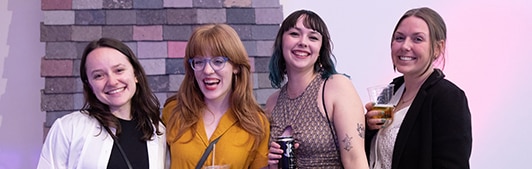 A group of young women posing for the camera.
