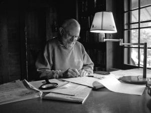 Oliver Sacks writing at a desk