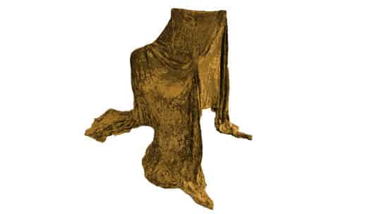 A chair draped in gold fabric