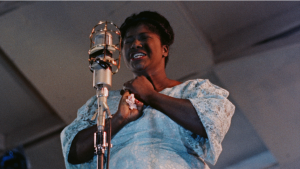 A woman singing at a microphone