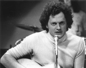 Harry Chapin playing guitar