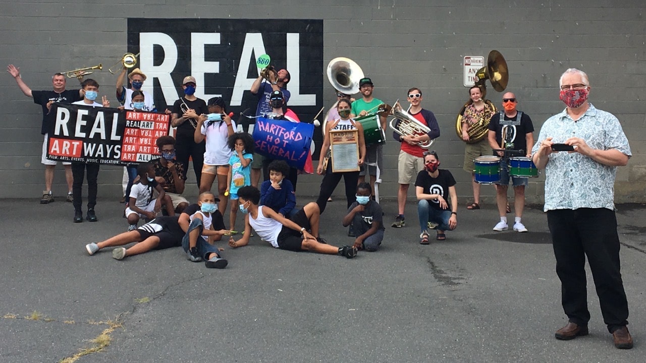 Real Art Ways staff, local children, and local band Hartford Hot Several after a Parade through Parkville commemorating 30 years of Park Art.