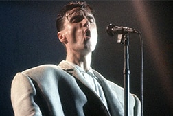 A man singing into a microphone.