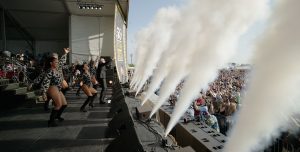 performers and a crowd at Jazz Fest in New Orleans