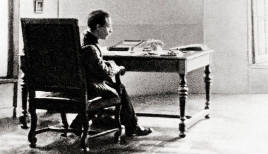 Rilke sitting at his desk