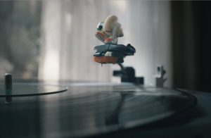 a shell with personality standing on a record player needle