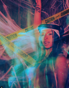 DJ Sonia Sol standing in front of caution tape 