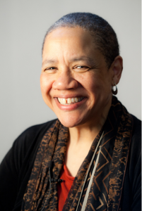 A headshot of an African American woman smiling at the camera.