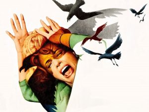 A portrait of a woman screaming while getting attacked by birds.