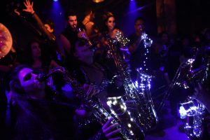 A close up of a woman playing the saxophone.