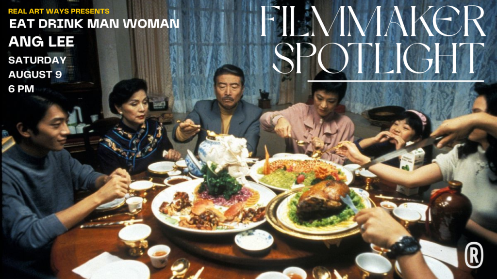 A family gathers around a dinner table for an elaborate meal.